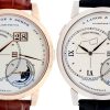 Two luxury A. Lange & Söhne watches side by side: rose gold with brown strap and white metal with black strap, both with large date windows and moon-phase dials at the bottom right.