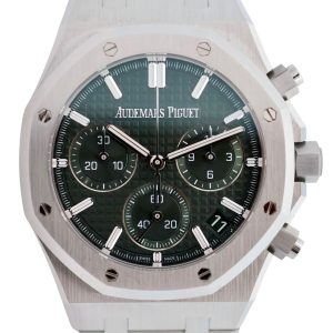 Close-up of an Audemars Piguet Royal Oak chronograph watch with a green dial, white hour markers, and hexagonal screws on the bezel.