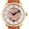 Gold FP Journe wristwatch with pink dial, white chapter ring, and brown leather strap (close-up).