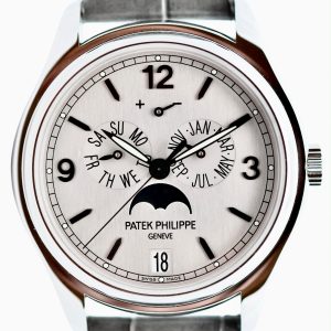 Close-up of a Patek Philippe wristwatch with day and month subdials, a date window, and a moon phase indicator on a silver dial.