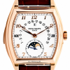 5013R Rose gold Patek Philippe wristwatch with white dial showing day, date, month windows, and moon-phase subdial.