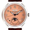 Patek Philippe wristwatch with peach dial, day and date windows, moon phase subdial, and brown leather strap