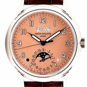 Patek Philippe wristwatch with peach dial, day and date windows, moon phase subdial, and brown leather strap