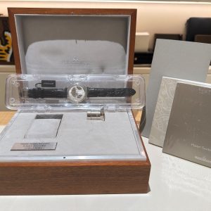 Jaeger-LeCoultre Master Minute Repeater in a wooden presentation box with the watch on a velvet insert, plus two accompanying booklets nearby