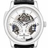 Skeleton-faced Jaeger-LeCoultre wristwatch showing exposed gears, power reserve and spring-torque indicators on a white dial with black strap precision detail.