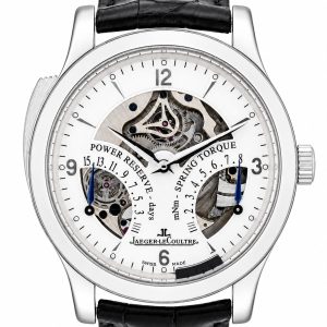 Skeleton-faced Jaeger-LeCoultre wristwatch showing exposed gears, power reserve and spring-torque indicators on a white dial with black strap precision detail.