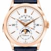Patek Philippe rose-gold wristwatch with white dial showing day, date, month windows, and moon phase subdial.