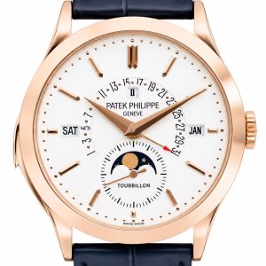 Patek Philippe rose-gold wristwatch with white dial showing day, date, month windows, and moon phase subdial.