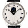 Close-up of a De Bethune wristwatch with Roman numerals, moon phase at center, and black hands on a white guilloché dial with a black leather strap.