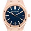 Rose gold Audemars Piguet wristwatch with a blue textured dial and octagonal bezel; date window shows 24.