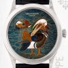 Patek Philippe wristwatch with an enamel dial showing a colorful bird; silver case, black leather strap.