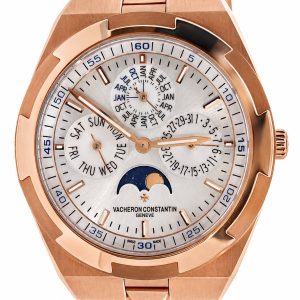 Rose-gold Vacheron Constantin wristwatch with day, date and month subdials and a moon phase indicator on a silver dial.