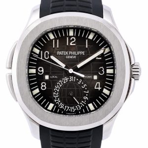 Patek Philippe Geneva steel wristwatch with a black dial, large numerals, and a black rubber strap.