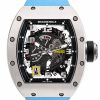 Richard Mille skeleton watch with a blue strap and exposed gears in a tonneau-shaped case.