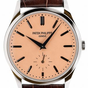 Patek Philippe wristwatch with peach dial, black baton markers, and brown leather strap, showing a small seconds subdial at 6 o'clock.