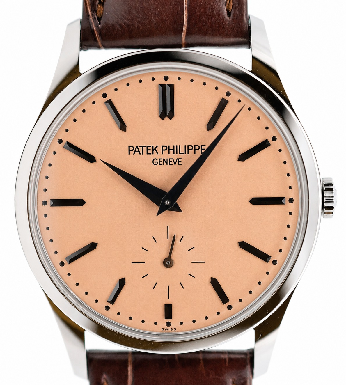 Patek Philippe wristwatch with peach dial, black baton markers, and brown leather strap, showing a small seconds subdial at 6 o'clock.
