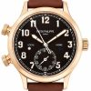 Rose gold Patek Philippe wristwatch with a black dial, cream numerals, brown leather strap, and a 6 o'clock subdial showing dates.