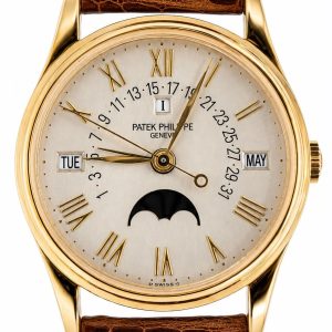 Gold Patek Philippe wristwatch with brown leather strap, Roman numerals, date ring, day and month windows, and moon phase display.