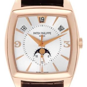 Rose gold Patek Philippe wristwatch with a white dial, day indicators, date window at 12 o'clock, moon phase subdial, and brown leather strap.